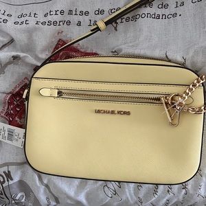 I am selling This brand new yellow Michael Kors cross body bag